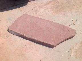 Straight cut line on a piece of flagstone.